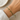 Faith Bracelet adjustable cross bracelet worn on wrist with gold-tone cross detail.