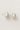 Felicia Stud Earrings in polished silver teardrop shape on beige linen background