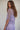 Side view of the Fishnet Top showing the relaxed sheer mesh silhouette.