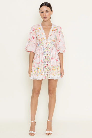 Woman wearing a floral dress on a white background