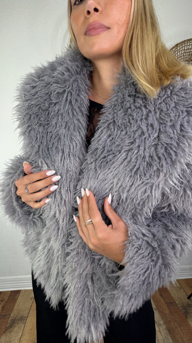 Close-up of the Frost Gray Luxe Jacket showing its plush gray faux-fur texture and voluminous silhouette.