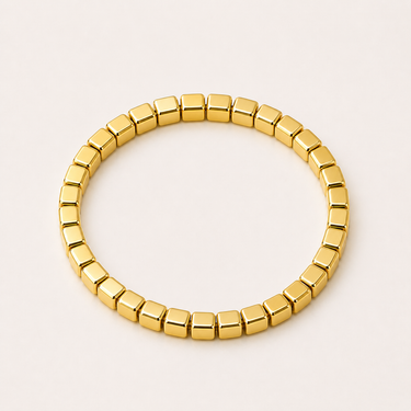 Frant Bracelet gold version with polished cube beads in stretch design, minimal stacked bracelet style.