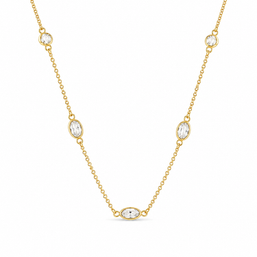 Gympi Necklace close-up of fine chain with evenly spaced stone details on neutral background, highlighting light-catching gold finish