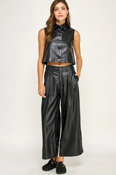 Model wearing the Hale Pant in black with a high-rise fit and cropped wide-leg silhouette.
