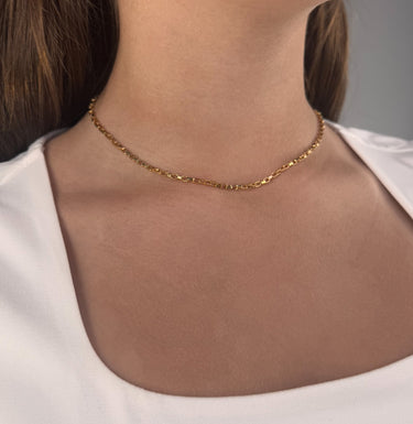 Model wearing Halo Necklace by Matte, gold filled rectangular link chain, 16 inch