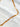 Halo Necklace by Matte, gold filled rectangular link chain on white marble surface