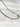 Halo Necklace by Matte, silver rectangular link chain on white marble surface