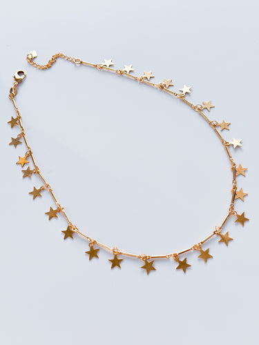 Hilaria gold filled star necklace by Matte, celestial charm choker on white background