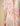 A multicolored floral lace-up cover-up dress with star accents and intricate lace details, displayed on a person.