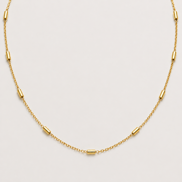 Jazmine Necklace featuring a delicate 18-inch gold-filled chain with polished elongated station bead accents evenly spaced throughout.