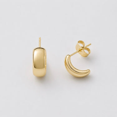 Kayseri Hoop Earrings featuring polished gold-plated hoop earrings with a smooth domed rectangular front, rounded open hoop silhouette, high-shine finish, lightweight design, secure post-back closure, and a modern minimalist style.