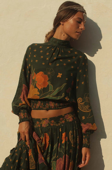Lybird Blouse by Matte – floral green blouse with high neck and smocked cuffs, front detail view