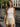 Macarena Shorts cream satin-inspired shorts with lace trim hem styled with a white sleeveless textured tank top.