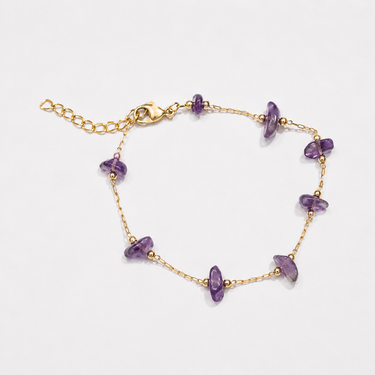 Matilde Bracelet featuring delicate faceted purple gemstone beads evenly spaced along a fine gold-tone chain with a lobster clasp closure and 1-inch extender chain, displayed on a white background.