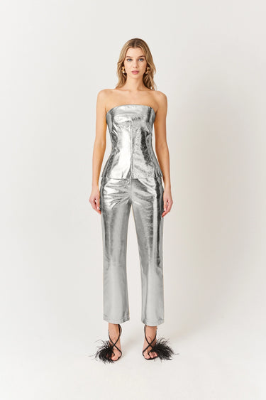 Woman wearing a silver metallic bandeau top and matching pants, with shimmering finish, Mave Bandeau Top by Matte.