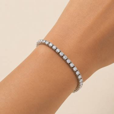 Mika Bracelet tennis bracelet worn on wrist featuring sparkling simulated diamond stones.