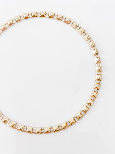 Mireya necklace by Matte, gold plated spiked choker on white background