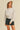 Moonbeam Sweatshirt by Matte – ivory oversized sweatshirt styled with black denim shorts and cap