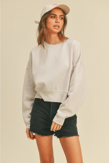 Moonbeam Sweatshirt by Matte – ivory oversized sweatshirt styled with black denim shorts and cap