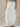 Mora wide-leg drawstring pants in ivory featuring oversized front patch pockets and a relaxed full-length silhouette.