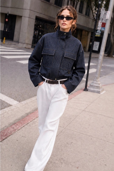 Murish Jacket styled with white pants, front view.