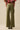 Nerina Pant – olive green wide-leg pants back view highlighting clean silhouette.