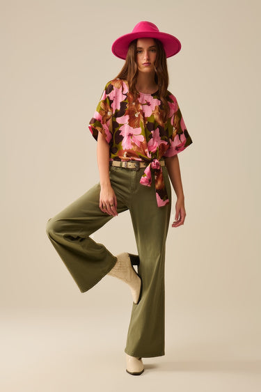Nerina Pant – olive green wide-leg stretch pants worn styled with printed top, full-length front view.