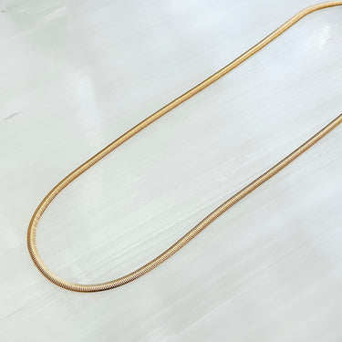 Noa necklace by Matte, gold plated flat herringbone chain on white background