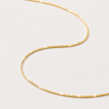 Nolia Necklace gold box chain necklace displayed on neutral background.