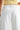 Octavia Jeans – back view of white wide leg jeans.