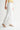 Octavia Jeans – white denim jeans, side view with relaxed silhouette.