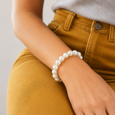 Orient Bracelet oversized pearl bracelet worn on wrist, showing large round luminous pearls and elegant everyday styling.