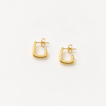 Palmira Hoop Earrings featuring polished gold-plated mini hoop earrings with a rounded square silhouette, smooth mirror finish, lightweight hollow design, secure post-back closure, and modern minimalist style.