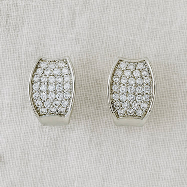 Front view of silver pavé huggies on linen backdrop, Plex Huggie Earrings.