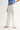 Relic Embroidered Denim Pants – angled front view showing clean white denim and cutwork detail.