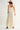 Roblen Pant soft ivory wide-leg pants back view highlighting elastic waistband and relaxed resort silhouette.