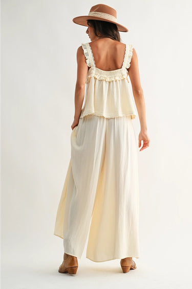 Roblen Pant soft ivory wide-leg pants back view highlighting elastic waistband and relaxed resort silhouette.