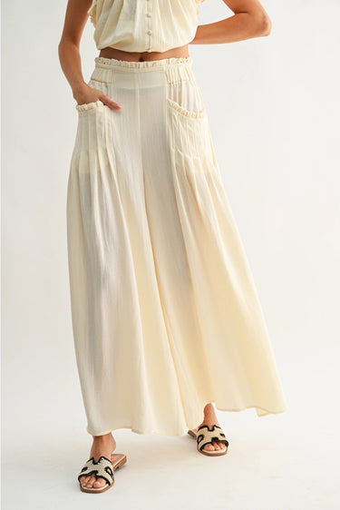 Roblen Pant soft cream wide-leg pants close-up of oversized pocket design and lightweight textured fabric.