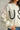 Close-up of Rope USA Knit Sweater in off white highlighting rope lettering and red stitchin