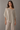 Rueth Poncho soft ivory poncho top with fluid drape and asymmetrical hem, featuring a loose silhouette for a relaxed, effortless look.