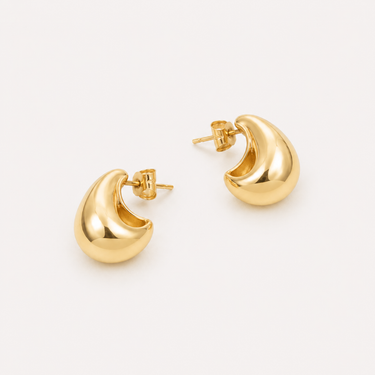 Runeth sculptural gold stud earrings with a high-polish dome design.
