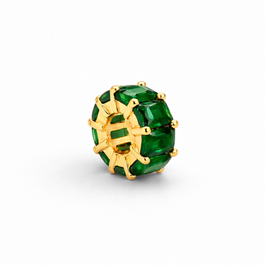 Sabi Charm green zirconia charm variation close-up showing rich gemstone tone and structured gold prong detailing