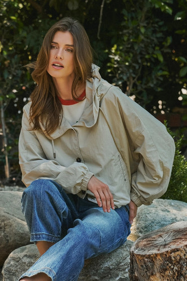 Lifestyle image of the Sakany oversized hooded jacket highlighting the gathered sleeves, relaxed fit, and casual everyday styling.