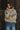Front view of the Sakany lightweight beige jacket showing the oversized pockets, hood, and comfortable fit.
