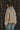 Back view of the Sakany hooded utility jacket displaying the relaxed silhouette, gathered hem, and lightweight construction.