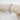 Silver link chain bracelet with rectangular oversized links displayed on wood stand - Matte Jewelry