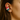 Close-up of an ear wearing colorful star rings as ear cuffs!