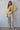 Full-length front view of the Syrat Sweater showcasing the oversized fit, embroidered bird detail, relaxed sleeves, and effortless everyday styling.