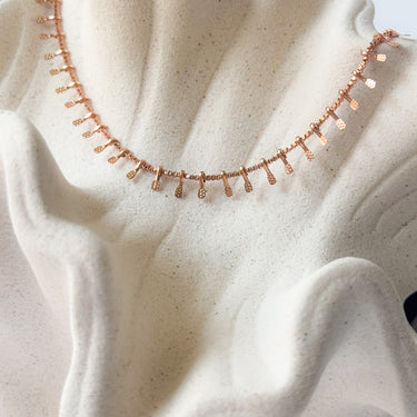 Taina rose gold plated necklace by Matte, unique geometric chain on neutral fabric