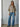 Talina lightweight oatmeal knit cardigan featuring a soft knit texture, relaxed fit, and button-front closure, paired with blue denim.
